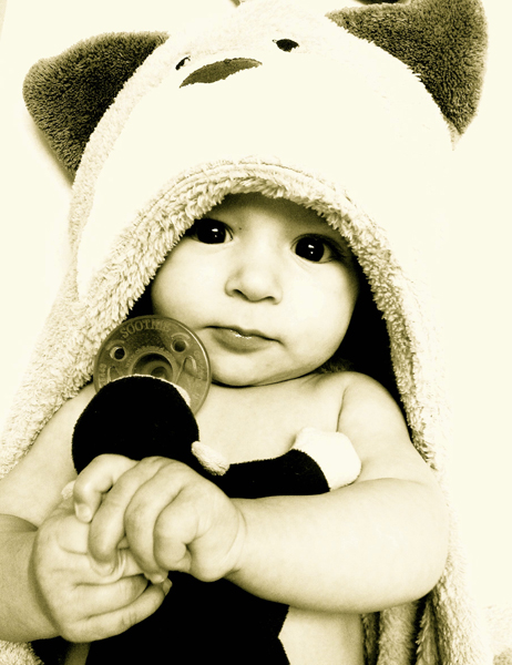 Portrait of a baby in a hooded sweater