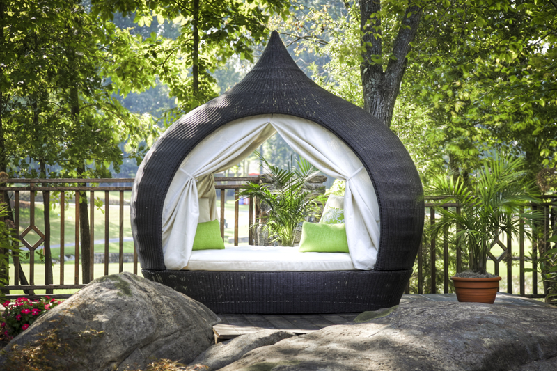 Outdoor pod chair photographed in a garden
