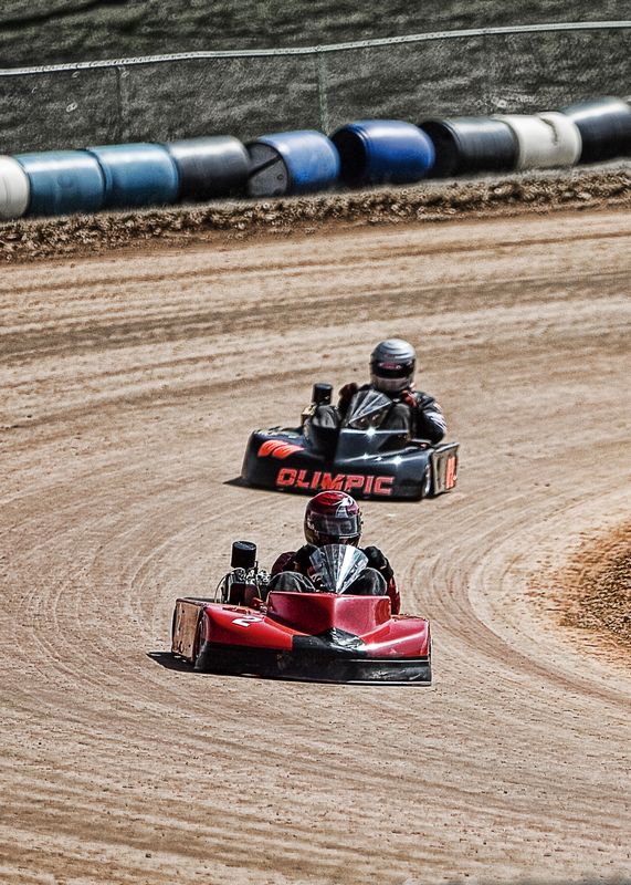 Go-kart racing on a dirt track